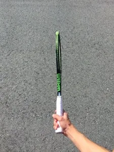 Tennis semi-western forehand grip — heel pad and index knuckle on bevel four