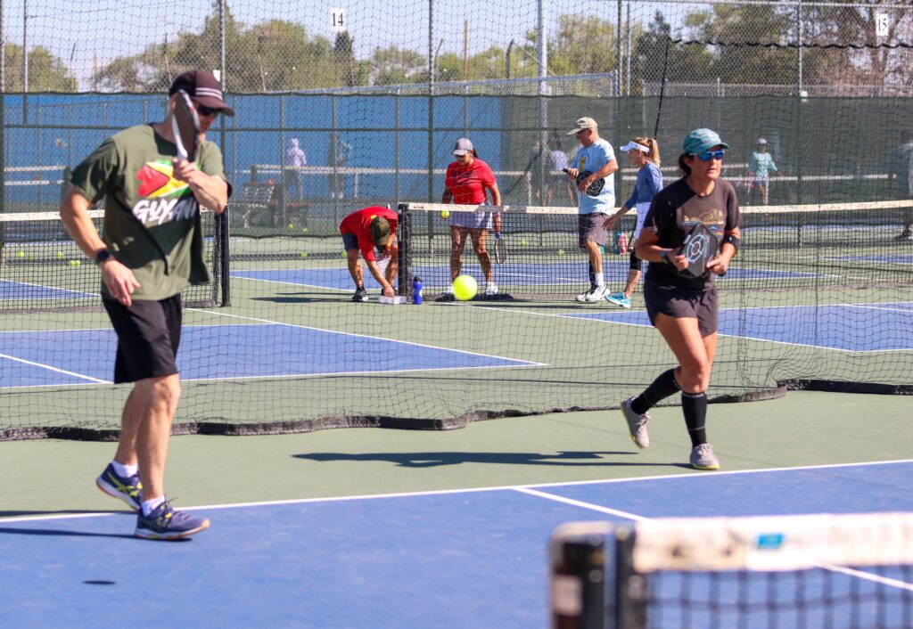 Pickleball players on outdoor courts at the Reno Tennis Center